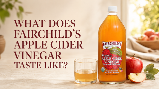 Fairchild's Apple Cider Vinegar bottle with apples and a glass of ACV for tasting