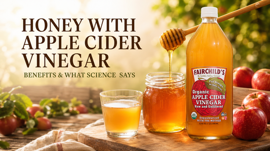 Honey with Fairchild’s Organic Apple Cider Vinegar, honey dipper and fresh apples